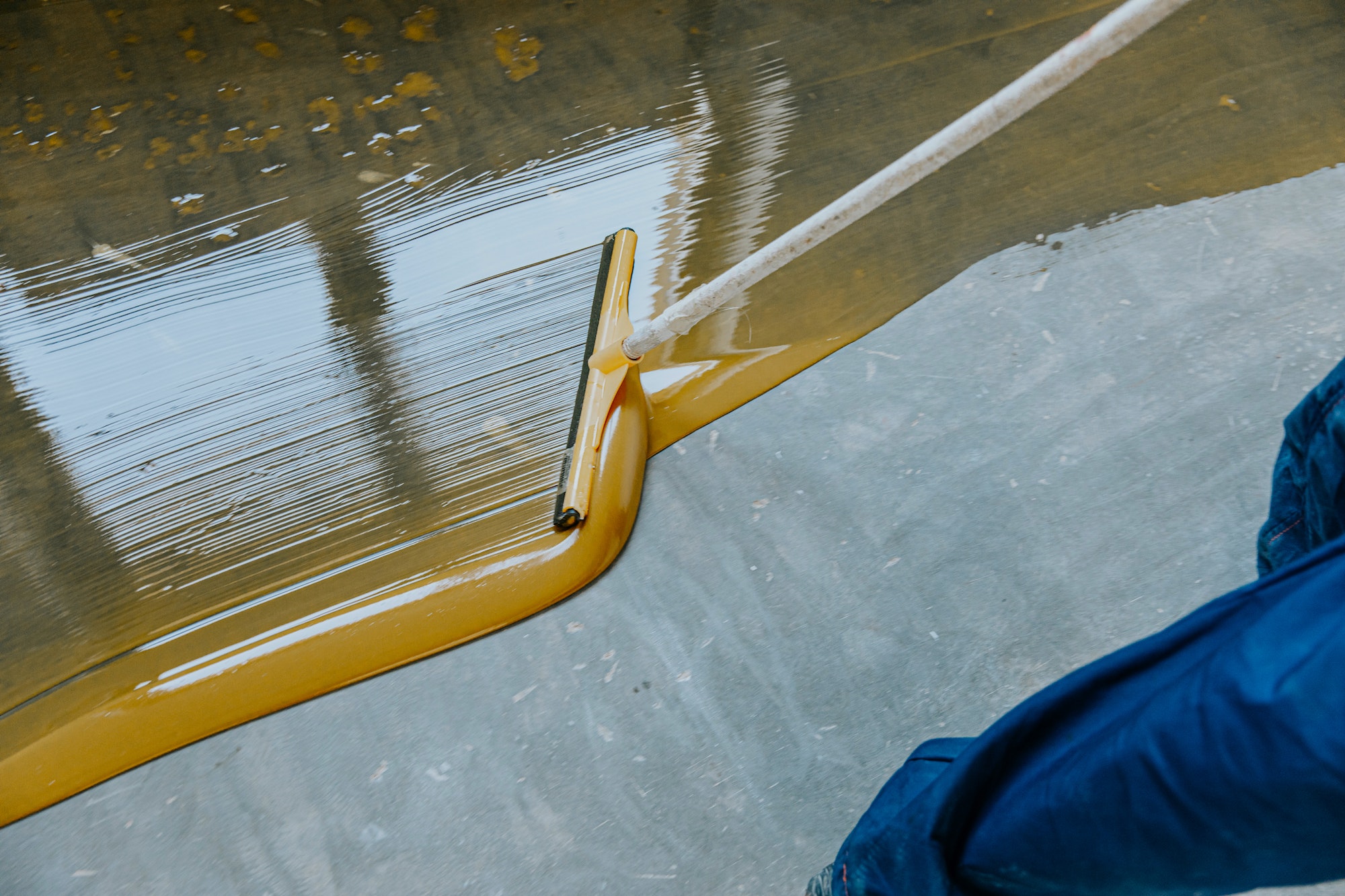 Epoxy resin applied to the floor. Industrial hall with colored floor