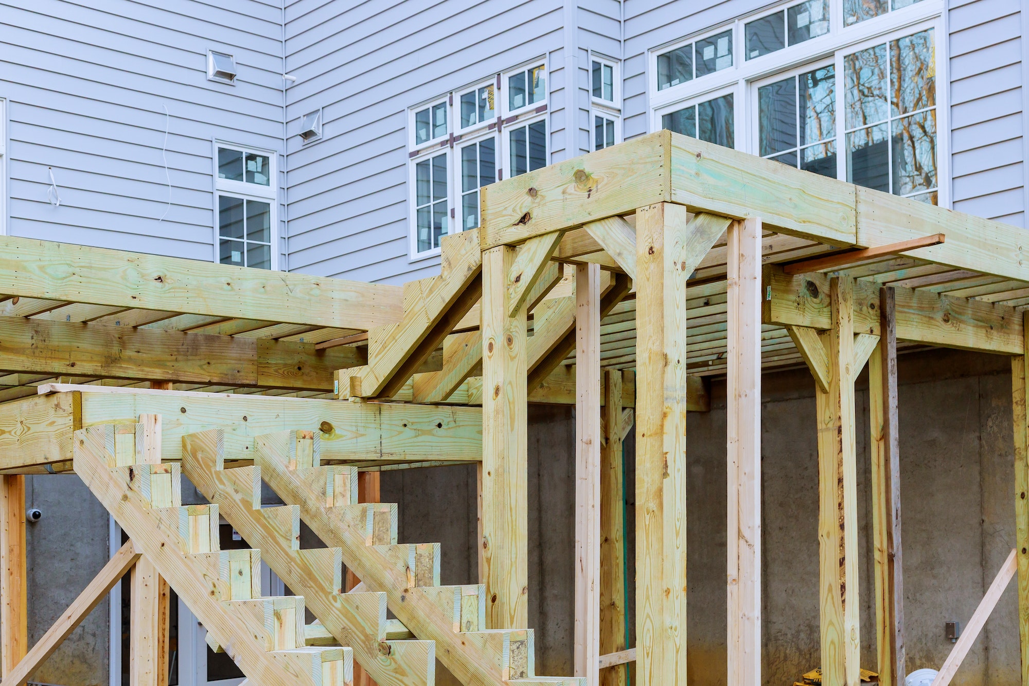 Fragment planks installing wood floor for patio deck with new wooden decking