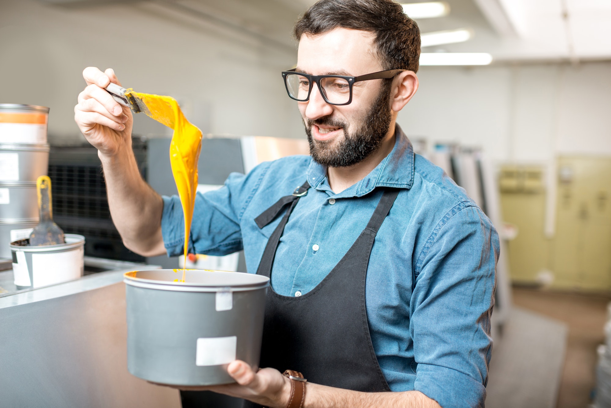 Typographer with paint at the manufacturing